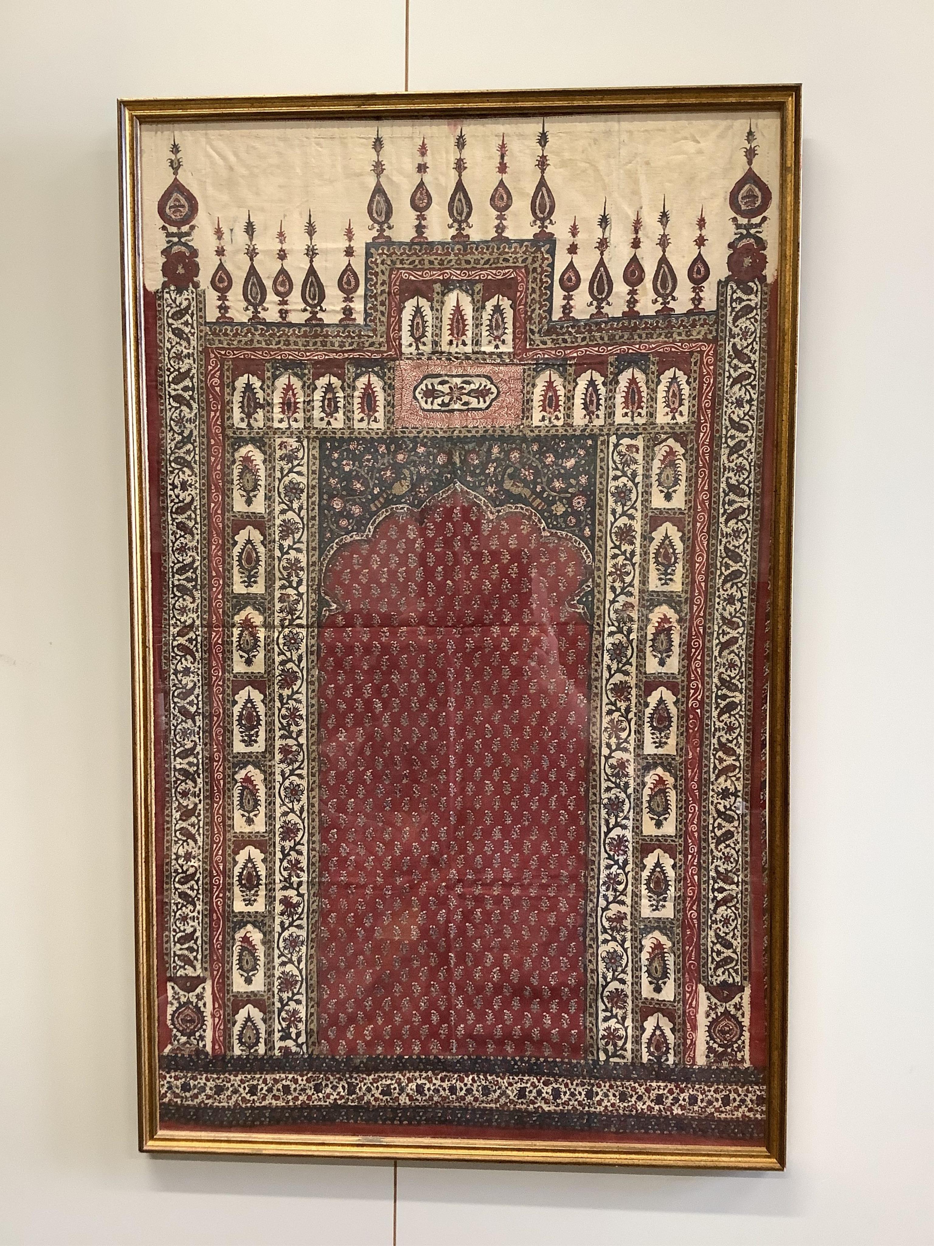 Two framed 19th century Indian Kalamkari boteh block printed prayer Niches, possibly from Machilitanam and a similar framed block printed square, possibly part of a table cover, largest 53cm wide x 67cm high (3). Conditi